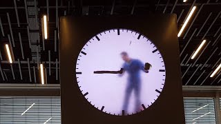 The Man in the Clock  Amsterdam Airport Schiphol  Who live in clock [upl. by Ycnan588]