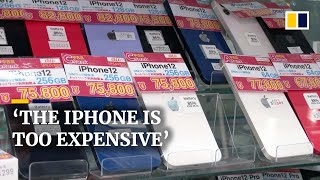 Japanese consumers snap up used iPhones as plunging yen puts highend gadgets out of reach [upl. by Jonell623]