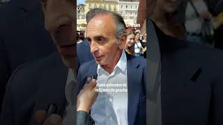 Eric Zemmour frappe une femme qui vient de lui jeter un œuf sur un marché en Corse [upl. by Uno523]