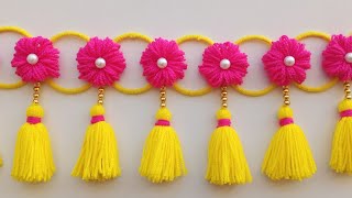 ऊन से बनाए नए डिजाइन की तोरणWoolen toran designWoolen flower door hangingWoolen craft ideaswool [upl. by Adnaluoy]