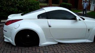 350z veilside bodykit lowered on active hydraulics 20inch rims pearl white jap speed exhaust [upl. by Ruphina]