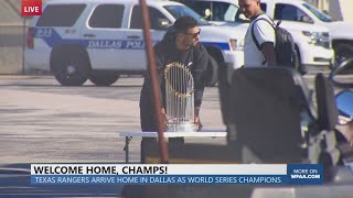 Texas Rangers Marcus Semien brings World Series trophy off plane at Dallas Love Field [upl. by Ji]