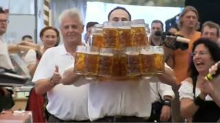 Oktoberfest Beer World Record  Waiter Carries 27 Full Beer Mugs in Germany HD [upl. by Ubald521]