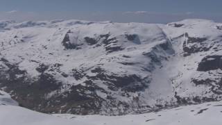 Skiing in summer snowy mountains Røldal Stordalselva  Flying Over Norway [upl. by Teiv379]