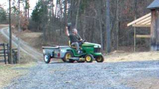 john deere lawnmower and manure spreader man goes for a ride [upl. by Atteyram230]