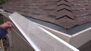 Installing gutter guards on an asphalt shingle roof [upl. by Alegna]