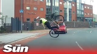 Hapless bike cop goes FLYING over the handlebars [upl. by Charters]