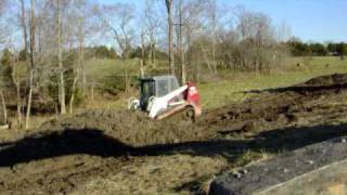 TakeuchiTL150 Skid Steer Moving mud [upl. by Lavena990]