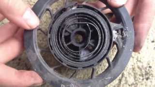 PushMowerRepaircom  Briggs 35HP Recoiling a Starter Spring [upl. by Etnad]