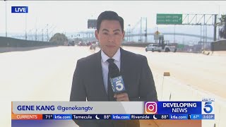 Workers clearing burnedout semi from San Pedro freeway [upl. by Hibben]