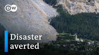 Giant rockslide stops shy of burying entire Swiss village  DW News [upl. by Hagile]