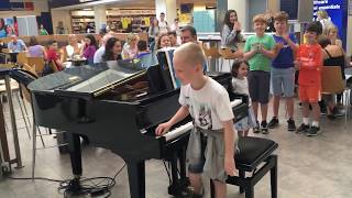 Amazing airport pianist Harrison aged 11 plays Ludovico Einaudi cover Nuvole Bianche [upl. by Yvon]