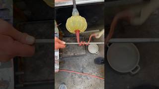 Glassblower whips up a pumpkin stem glassartist glass art [upl. by Shandee718]