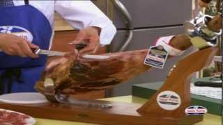 How to Carve Iberico Ham from wwwfoodsofspaincouk  Spanish Food Online [upl. by Urita751]