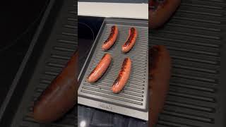 Grilling sausages in our Poggenpohl kitchen with the Miele induction cooktop and grille pan [upl. by Bubalo280]