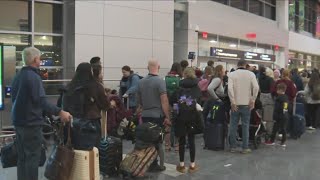 Holiday travel rush continues at Logan Airport [upl. by Laertnom681]