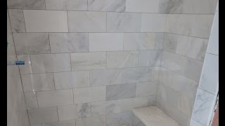 Marble Carrara Tile bathroom Part 3 close up look Installing Carrera marble tile and bench seat [upl. by Calmas]