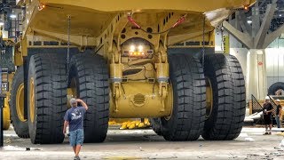 Moving a massive Caterpillar 794AC dump truck [upl. by Nhtanhoj]