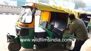 Tuktuk in India gets a new yellow cover to look all bright and smart advertising money to boot [upl. by Eilyac177]