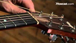 How to Restring a Steel String Guitar  Guitar Lessons [upl. by Kirre913]