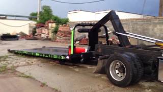 How to load and unload a car from a flat bed tow truck [upl. by Melcher77]