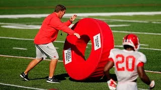 Rutgers coach Chris Ash uses giant tackling donuts to teach technique [upl. by Annairol577]