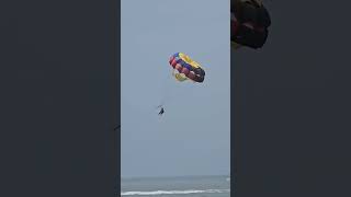 Experience the Thrill of Paragliding Over the Waters of Bali [upl. by Nauqyaj]