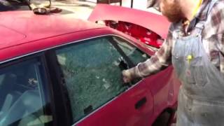 Breaking a car window with a center punch [upl. by Behlau94]