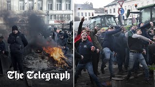 Police hose down eggthrowing farmers outside EU parliament in Brussels [upl. by Alyel]