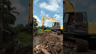 Komatsu PC 20 excavator cleans river flow [upl. by Drucie]