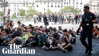 Police use pepper spray on seated climate protesters in Paris [upl. by Mulvihill]