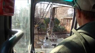 Excavator Tearing Out Concrete Driveway [upl. by Eikin]