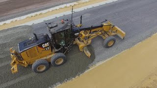 Cat 160M with Topcon 3D GPS spreading gravel  Drone video [upl. by Lilli]