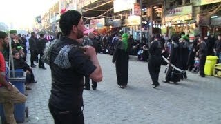 Iraqi Shiites perform Ashura rituals in Baghdad [upl. by Htomit]