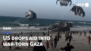 US drops aid into wartorn Gaza  AFP [upl. by Amalea]