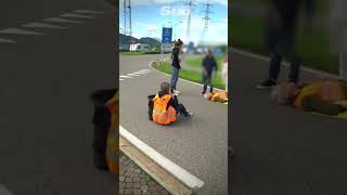 Eco protester knocked to the floor by car at protest [upl. by Einnor]