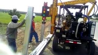 Highway guardrail installationfixing machine pile driver working in Indonesia [upl. by Nottus]