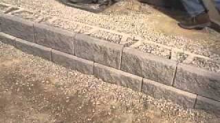 DIY Superstore  Installing a Retaining Wall [upl. by Nynahs]