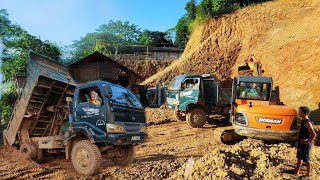 Young girl driving DooSan excavator to scoop up landslide soil Dump truck carrying and dumping soil [upl. by Mauceri332]