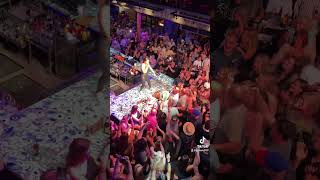 Woman crowd surfing in bar [upl. by Botsford]