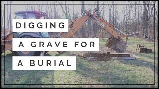 Digging a grave for a burial at a cemetery [upl. by Ongineb]