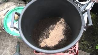 How I Plant Potatoes In a Tub or Bag Part 1 [upl. by Natsreik]