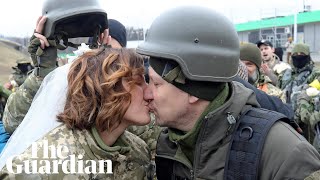 Ukrainian reservists marry in military fatigues at Kyiv checkpoint [upl. by Vanya586]