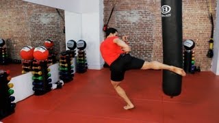 How to Do a Roundhouse Kick  Kickboxing Lessons [upl. by Yltnerb128]