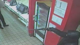 Armed robbery at McDonalds in north London captured on CCTV [upl. by Atinahc]