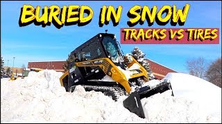 Tires or Tracks on a skid steer in Deep SnowCan you plow with a tracked loader [upl. by Abel593]