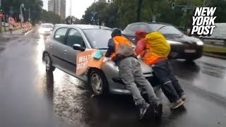 Irate drivers ram into climate protesters blocking traffic drag them hundreds of feet down highway [upl. by Nylirahs]