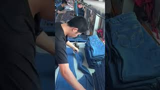 Factory workers ironing and shaping jeans on an assembly linehandmade shorts [upl. by Sigfried]