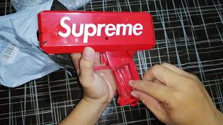 Supreme Money Gun  The Cash Cannon Money Gun  Super Gun [upl. by Siuoleoj]