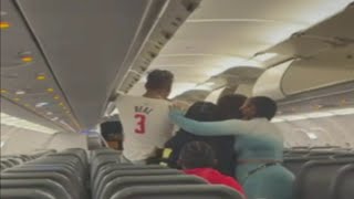 Brawl breaks out on Frontier Airlines flight between passengers at MIA [upl. by Arbas219]